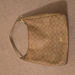 Coach Purse, creamy color with brown C's.